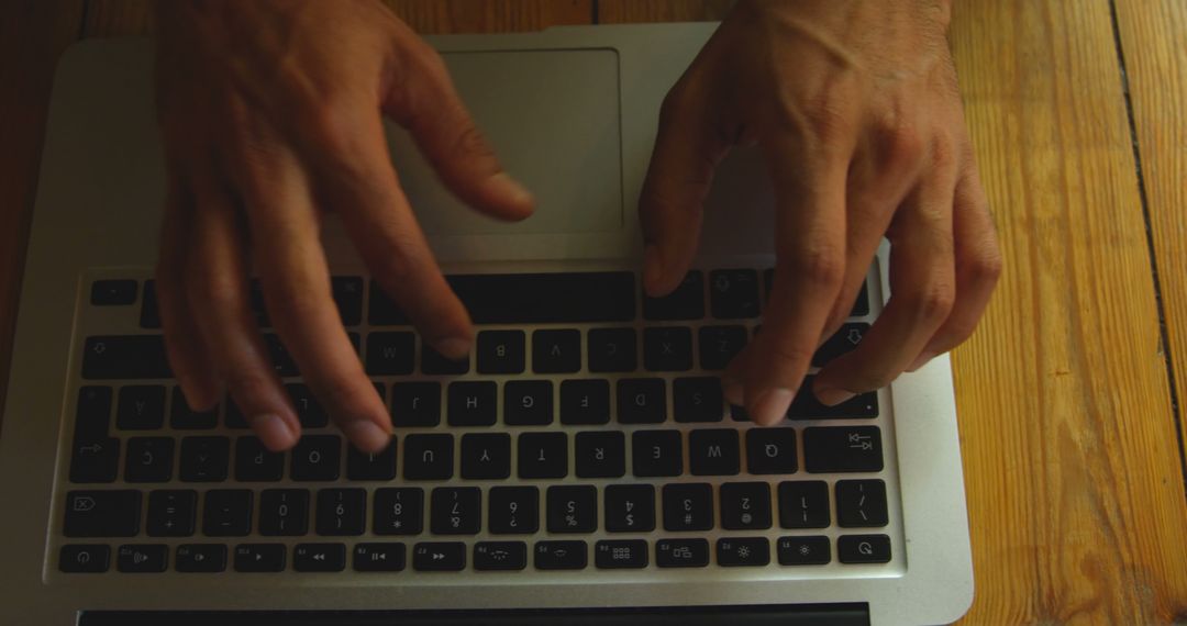 Person Typing on Laptop with Wooden Table Background - Free Images, Stock Photos and Pictures on Pikwizard.com