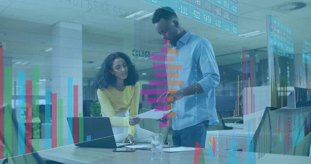 Colleagues Reviewing Documents with Data Overlay in Modern Office