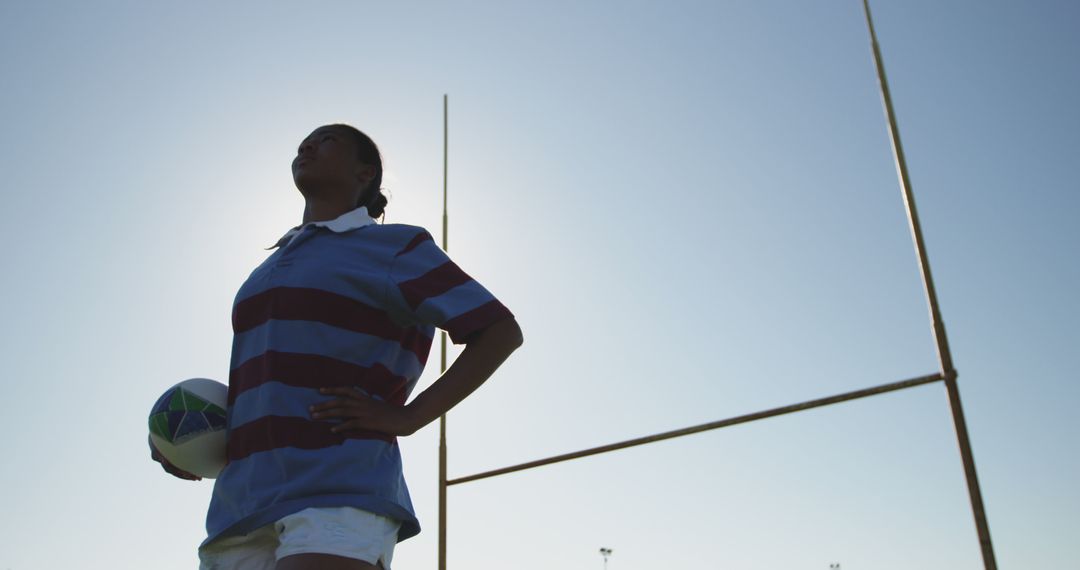 Female Rugby Player Holding Ball at Goal Posts in Training - Free Images, Stock Photos and Pictures on Pikwizard.com