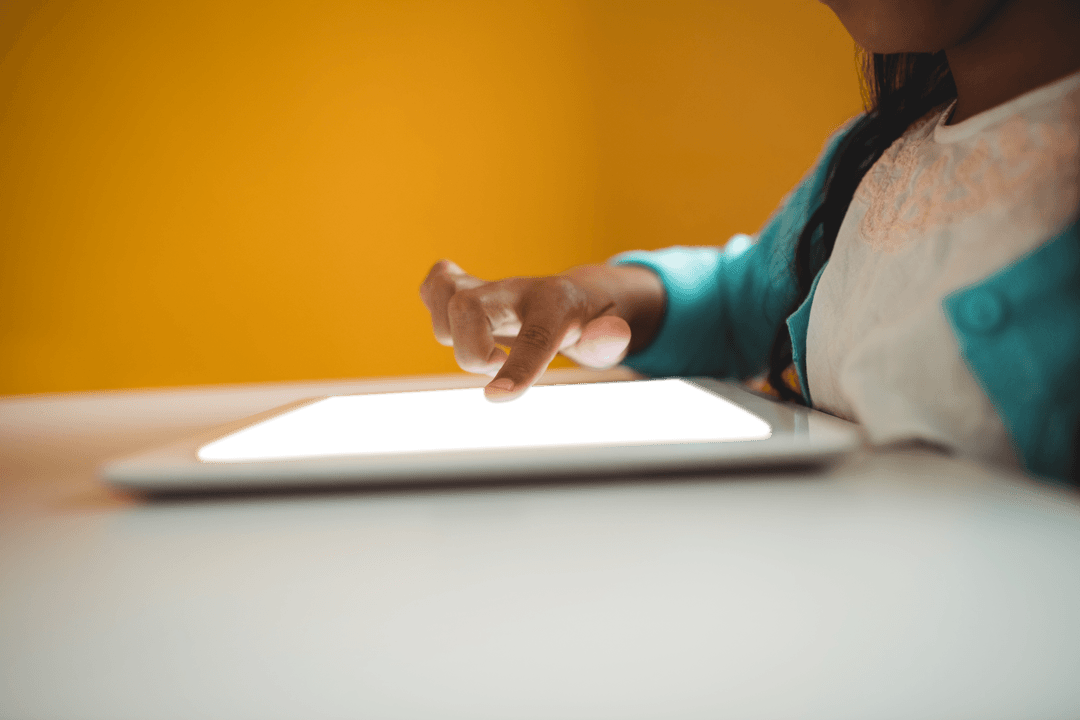 Girl Using Transparent Screen Tablet on White Table
