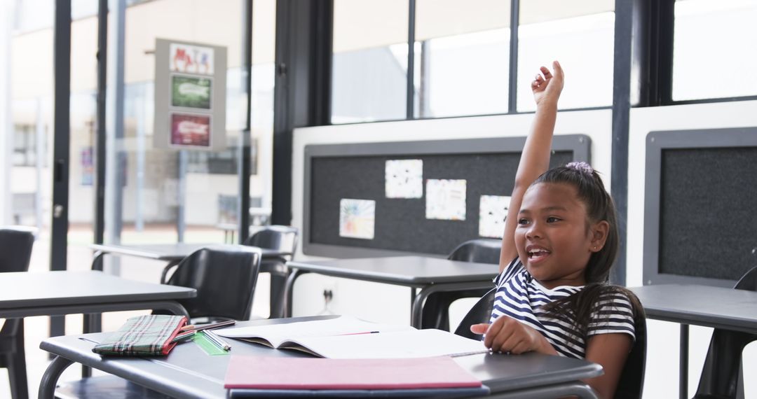 Enthusiastic Student Raising Hand in Classroom