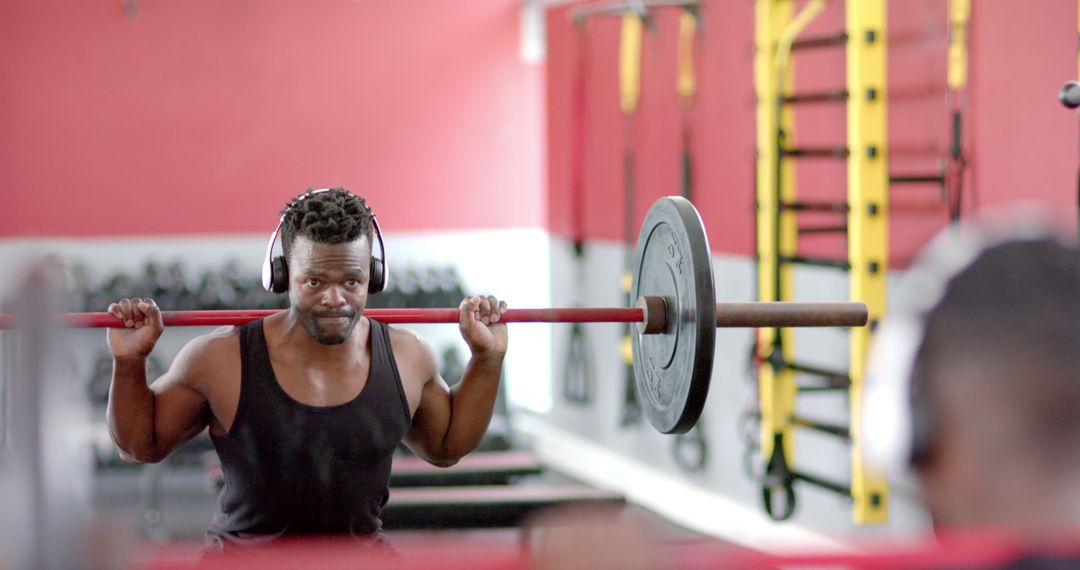 African American Man Training with Weights at Gym