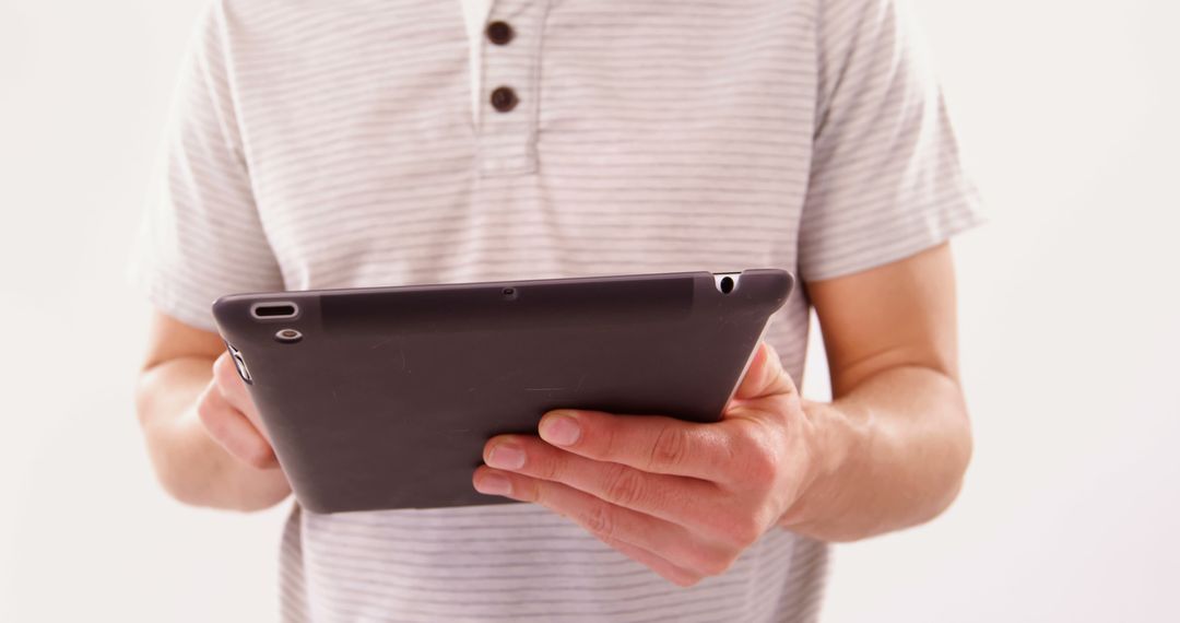 Man Using Tablet Device in Casual Wear - Free Images, Stock Photos and Pictures on Pikwizard.com