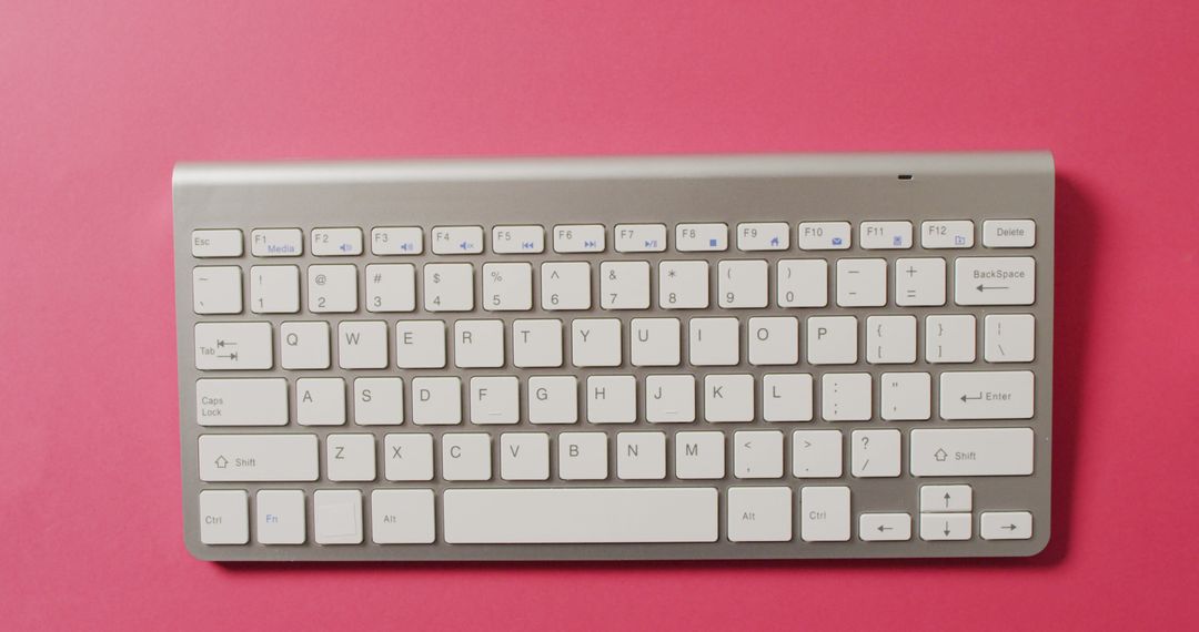 Modern Wireless Keyboard on Pink Background - Free Images, Stock Photos and Pictures on Pikwizard.com