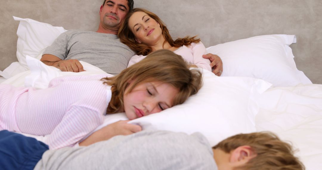 Family Sleeping Peacefully Together in Bed - Free Images, Stock Photos and Pictures on Pikwizard.com