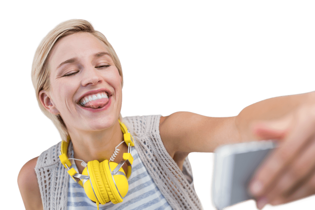 Playful Woman with Headphones Sticking Out Tongue in Fun Transparent Selfie