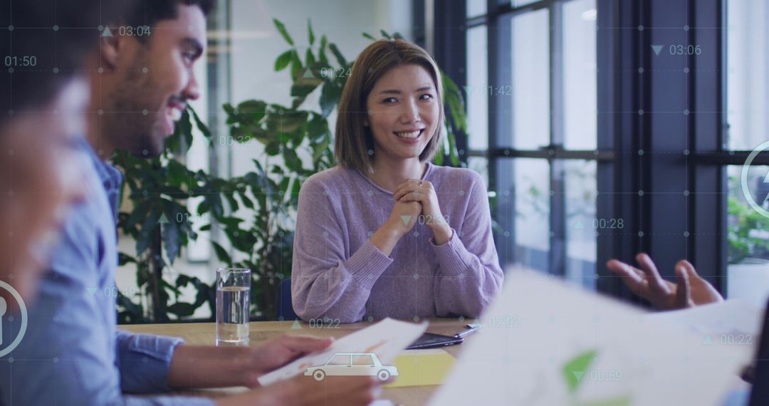 Diverse Team Examining Financial Reports in Modern Office