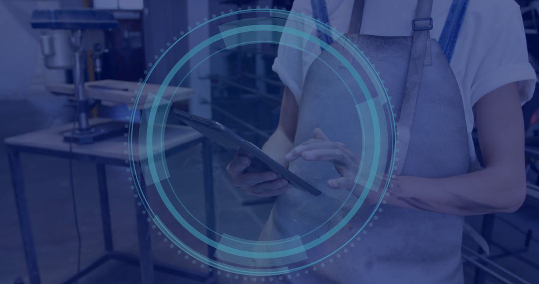 Craftsman Using Tablet for Precision in Workshop Environment