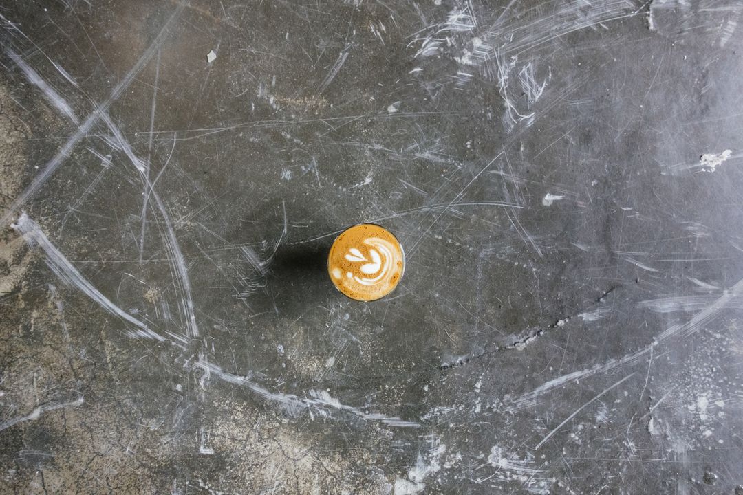 Aerial View of Cappuccino on Rustic Concrete Surface - Free Images, Stock Photos and Pictures on Pikwizard.com
