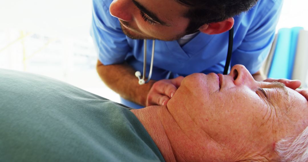 Doctor Checking Vital Signs of Elderly Male Patient - Free Images, Stock Photos and Pictures on Pikwizard.com