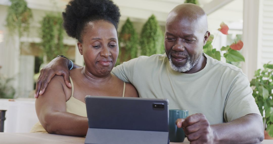 Senior Couple Enjoying Time Together with Tablet