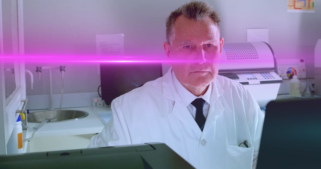 Caucasian Doctor Using Technology with Laser Graphics in Laboratory