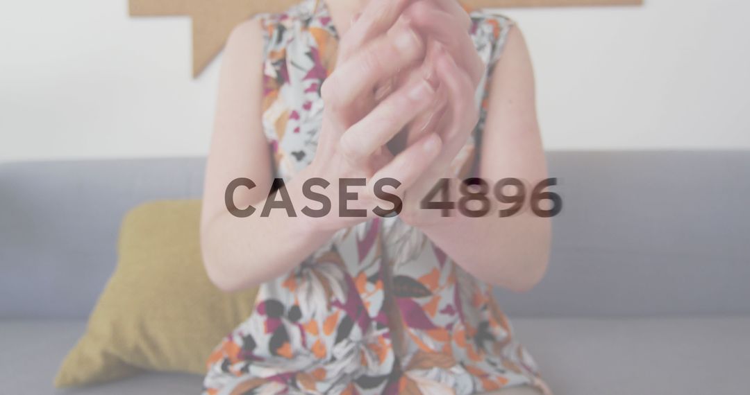 Woman Disinfecting Hands in Modern Office Environment