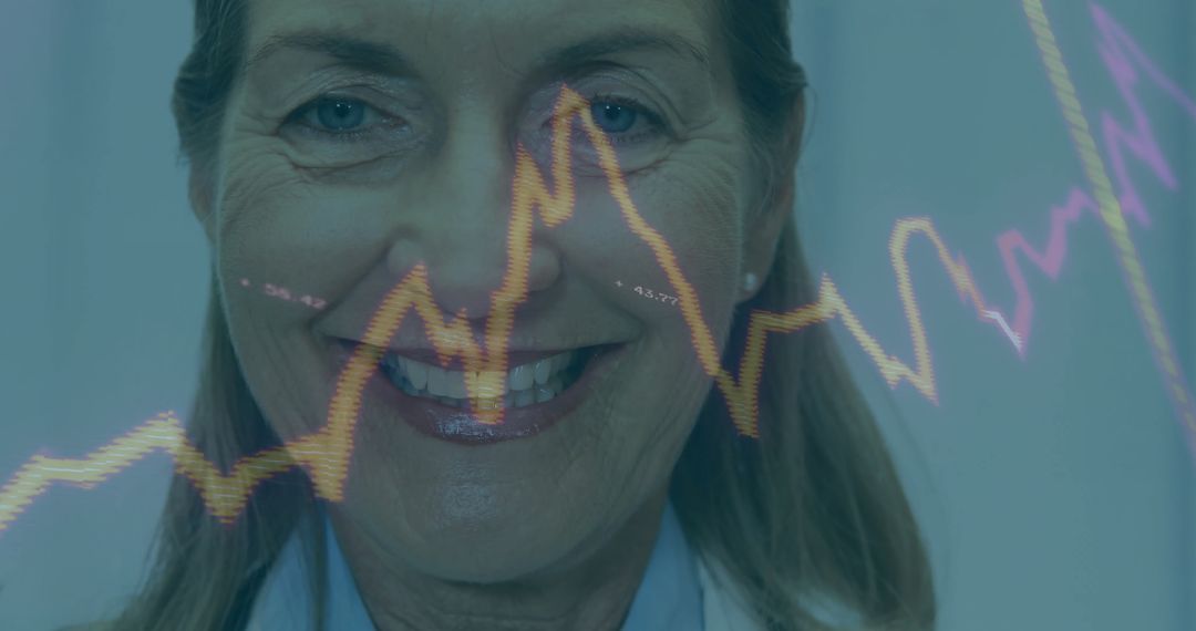 Smiling Senior Doctor Analyzing Medical Data with Graphs