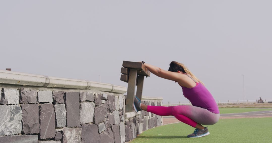 Woman Stretching on Promenade in Activewear - Free Images, Stock Photos and Pictures on Pikwizard.com