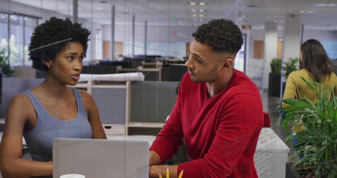 Colleagues Discussing Work with Digital Data Overlays