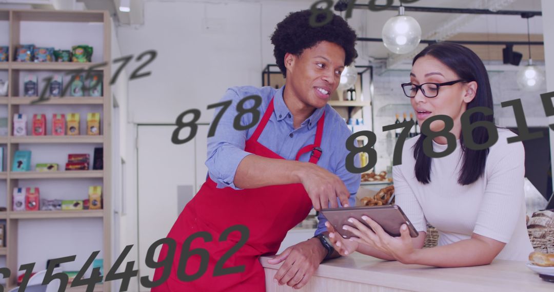 Shop Owners Analyzing Data for Business Optimization