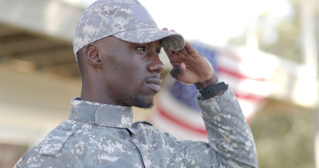 Proud African American Soldier Saluting Outdoors in Front of Flag - Free Images, Stock Photos and Pictures on Pikwizard.com