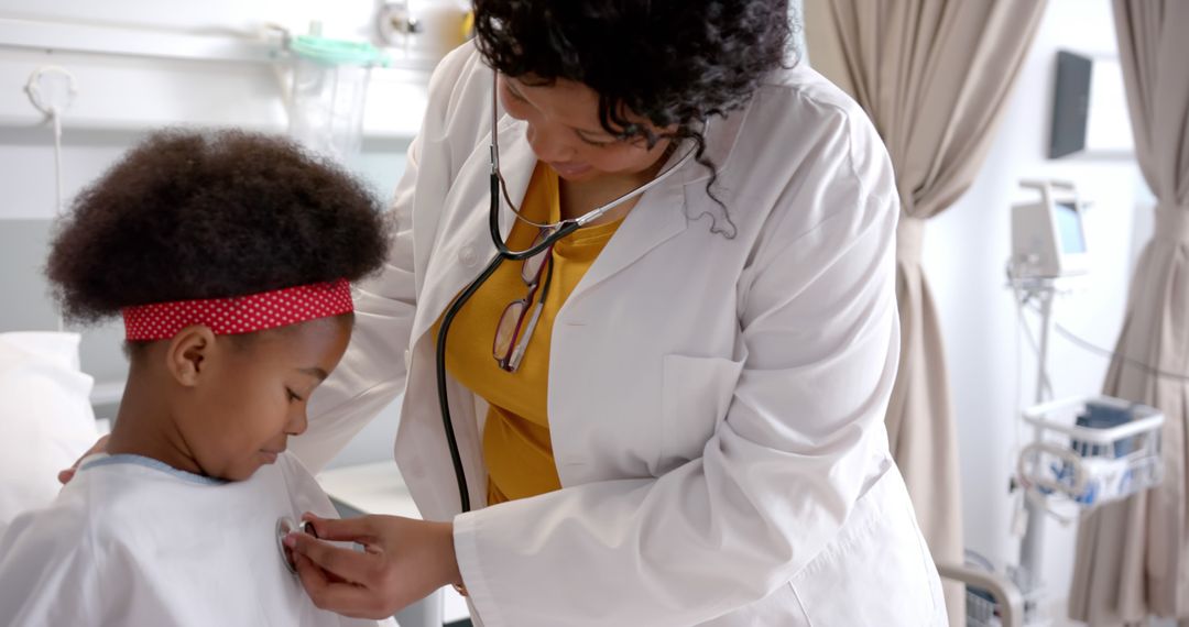 Caring Female Doctor Examining Young African American Girl in Hospital - Free Images, Stock Photos and Pictures on Pikwizard.com