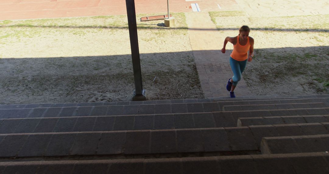 Woman Running Up Stadium Steps for Exercise - Free Images, Stock Photos and Pictures on Pikwizard.com