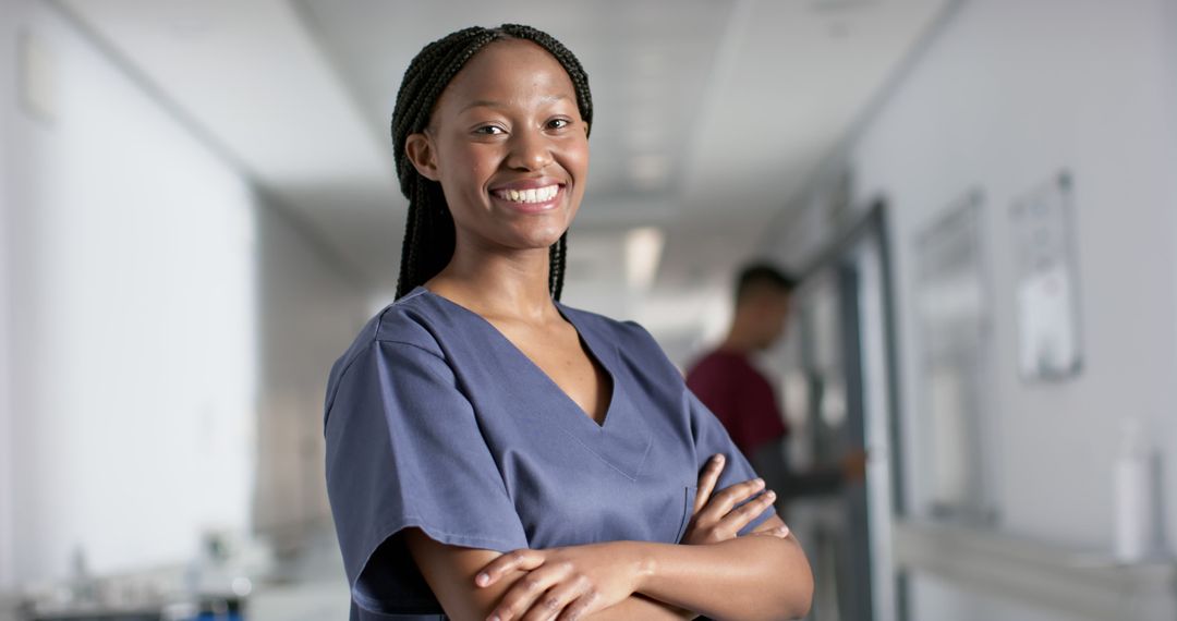 Confident Young African American Nurse in Hospital Corridor - Free Images, Stock Photos and Pictures on Pikwizard.com