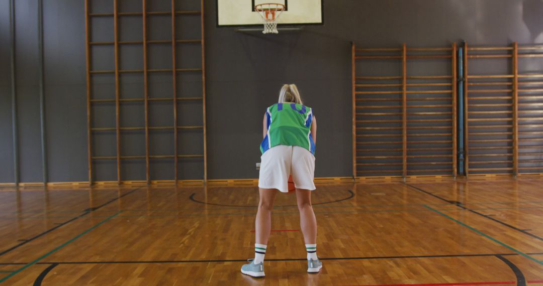 Female Basketball Player Focused on Shooting in Gym - Free Images, Stock Photos and Pictures on Pikwizard.com