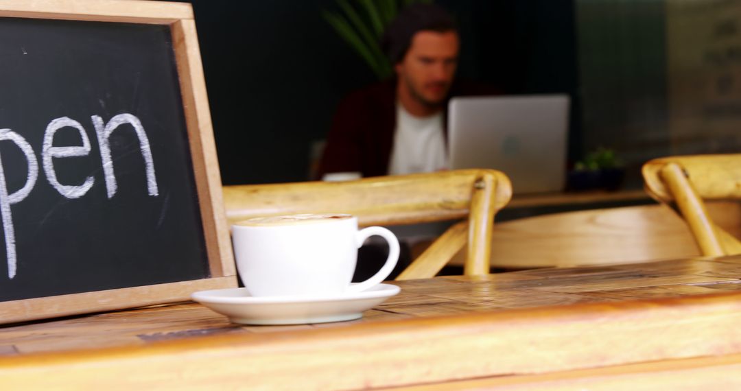 Cozy Cafe Ambiance with Coffee and Open Sign