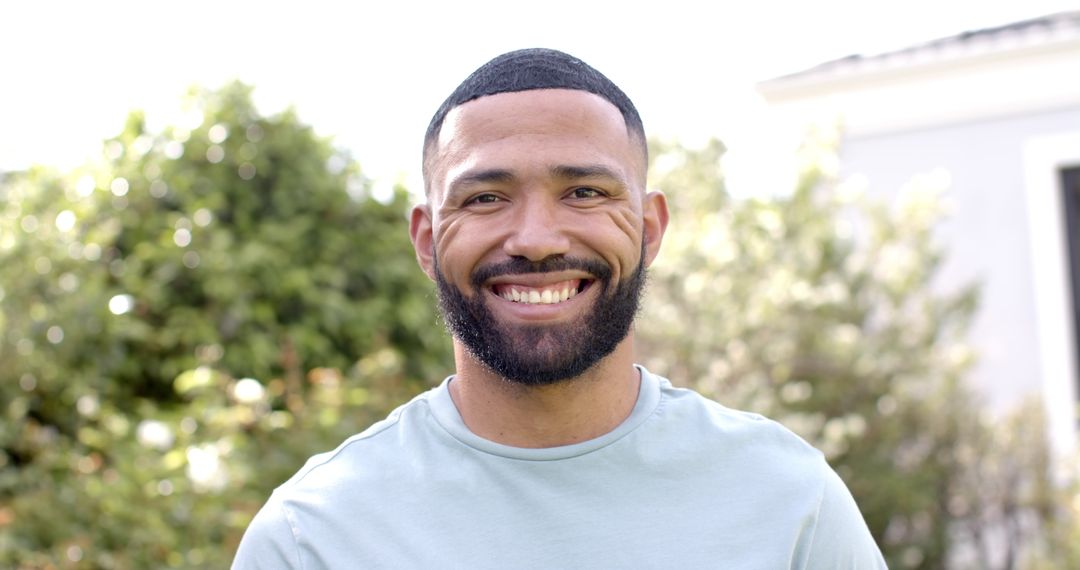 Smiling Man Enjoying Sunny Garden