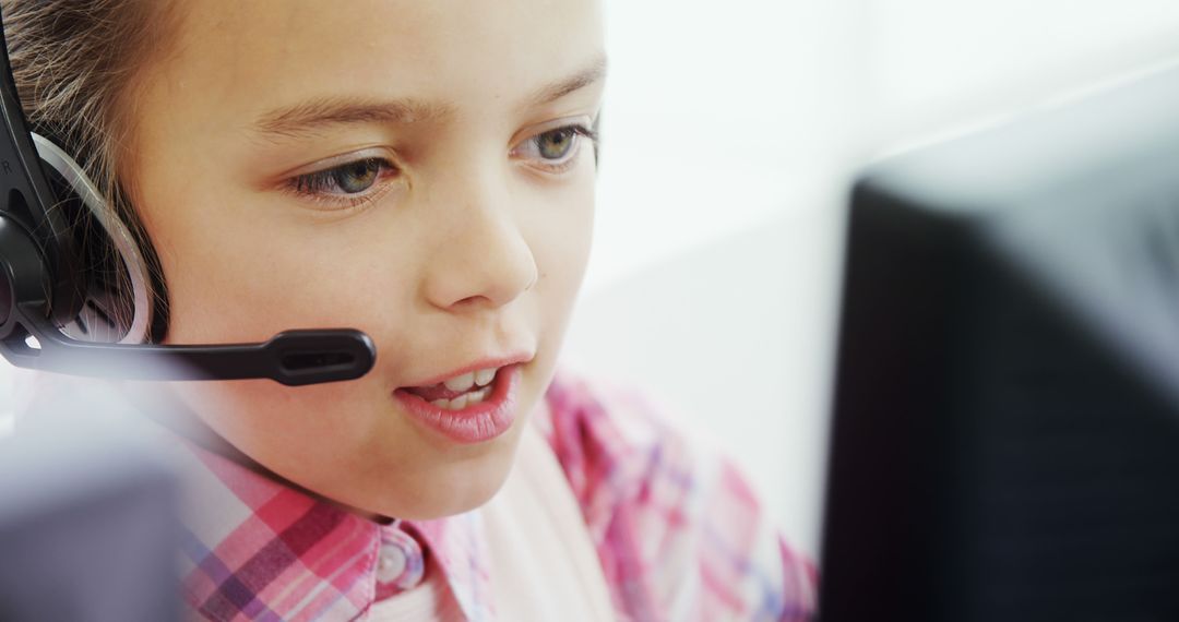 Young Child Wearing Headset Using Computer Indoors - Free Images, Stock Photos and Pictures on Pikwizard.com