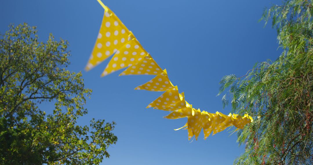 Yellow Polka Dot Bunting Decorates Outdoor Summer Party - Free Images, Stock Photos and Pictures on Pikwizard.com