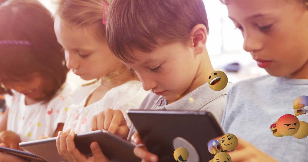 Children Using Tablets with Emojis Floating - Free Images, Stock Photos and Pictures on Pikwizard.com