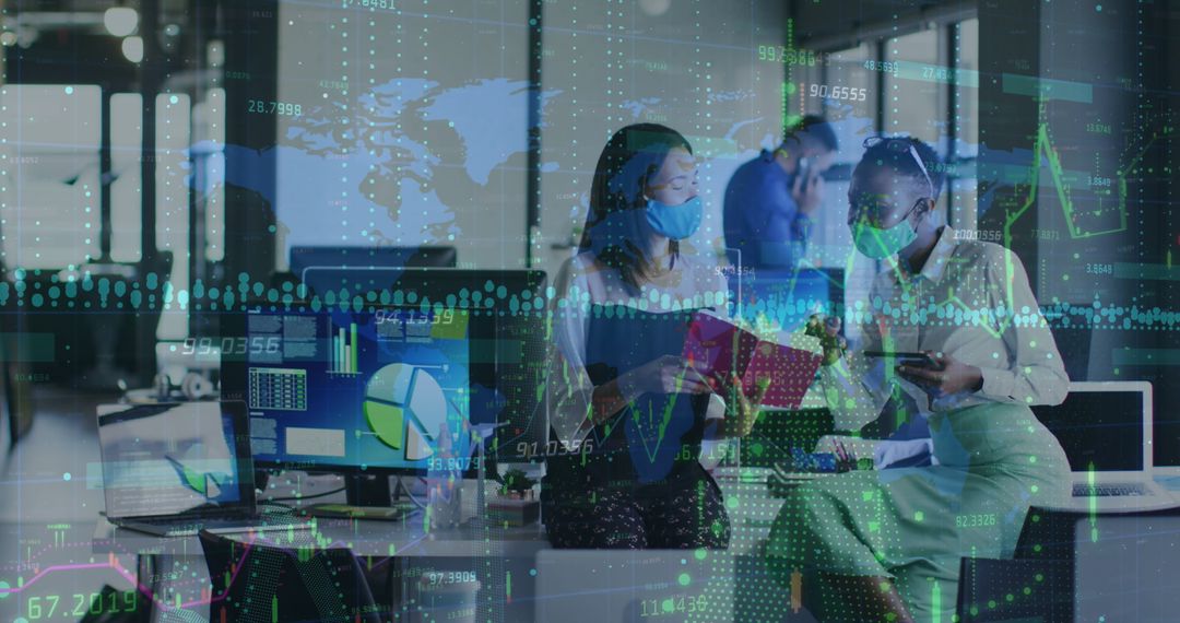 Diverse Professionals Analyzing Data with COVID-19 Precautions