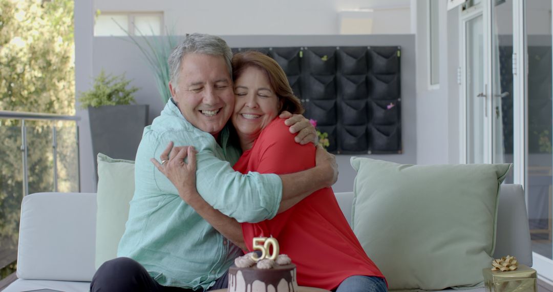 Senior Couple Celebrating 50th Anniversary with Cake and Joyful Elegance