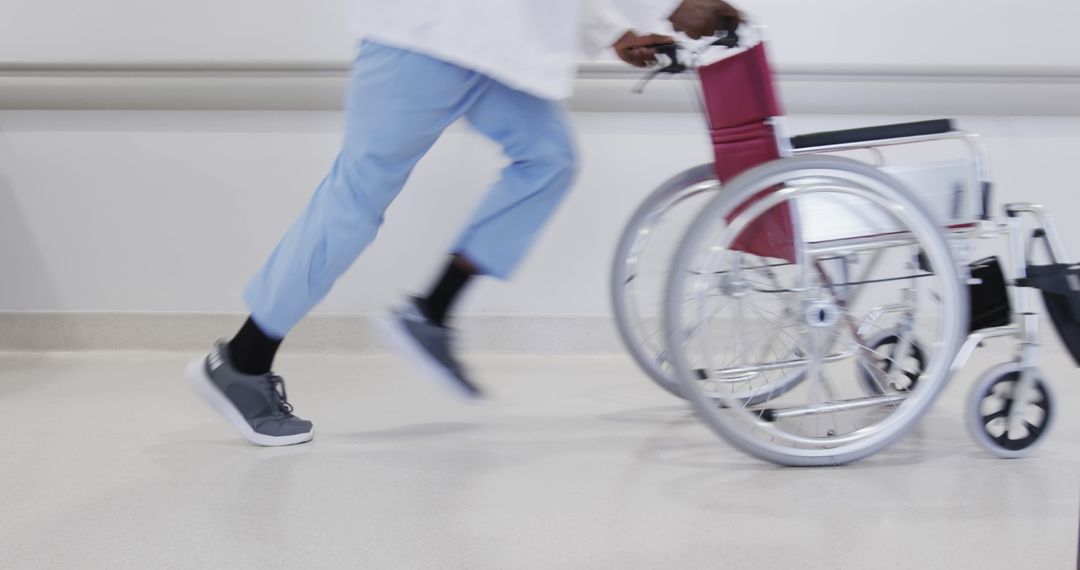 Nurse Pushing Empty Wheelchair in Hospital Hallway - Free Images, Stock Photos and Pictures on Pikwizard.com