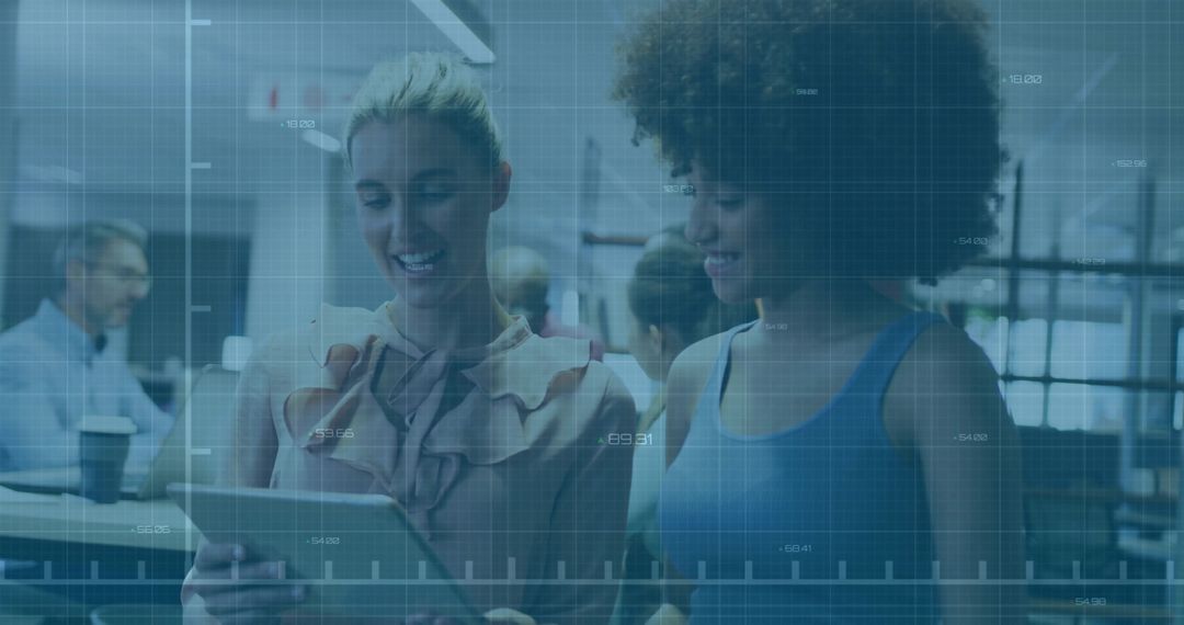 Diverse Colleagues Collaborating on Tablet in Open Office