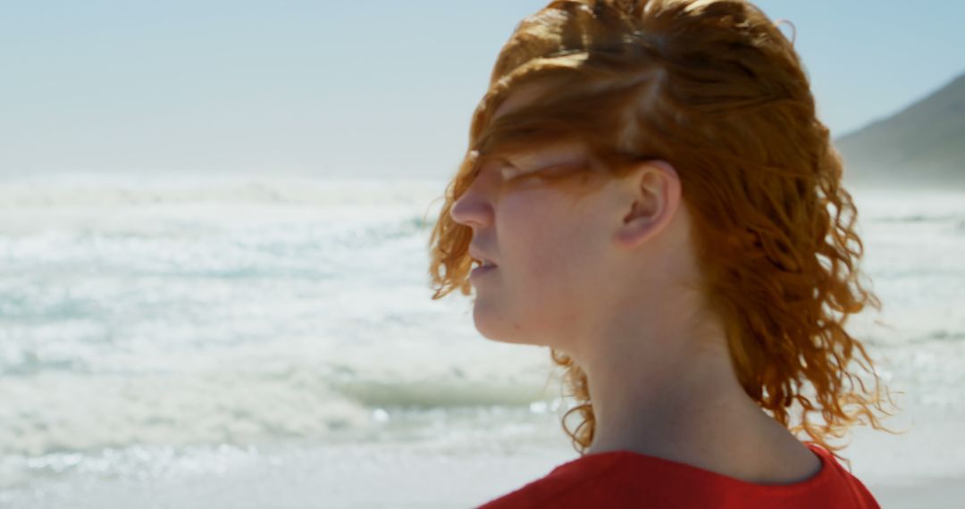 Woman with Red Hair Enjoying Beach Scenery - Free Images, Stock Photos and Pictures on Pikwizard.com