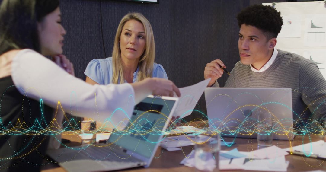 Diverse Team Discussing Business Projects with Digital Interference Effect