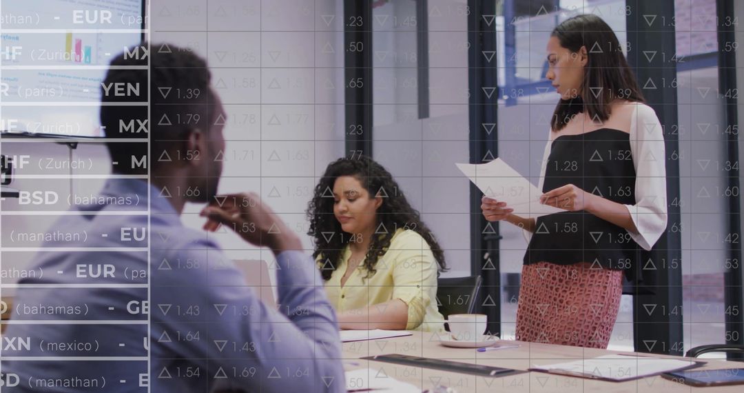 Diverse Business Team Analyzing Stock Market Trends in Office