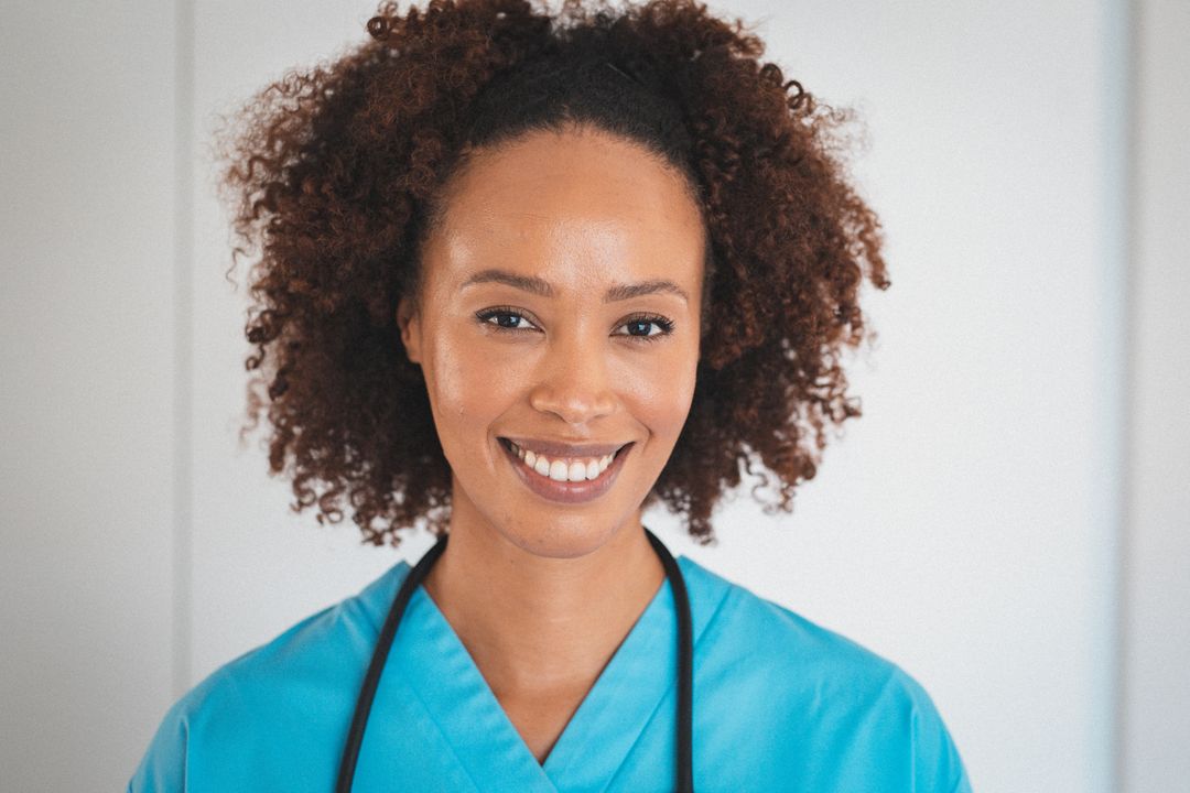 Portrait of happy biracial female doctor with stetoscope smiling - Free Images, Stock Photos and Pictures on Pikwizard.com