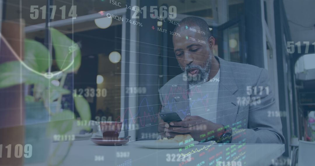Data Processing While Male Professional Uses Smartphone at Cafe