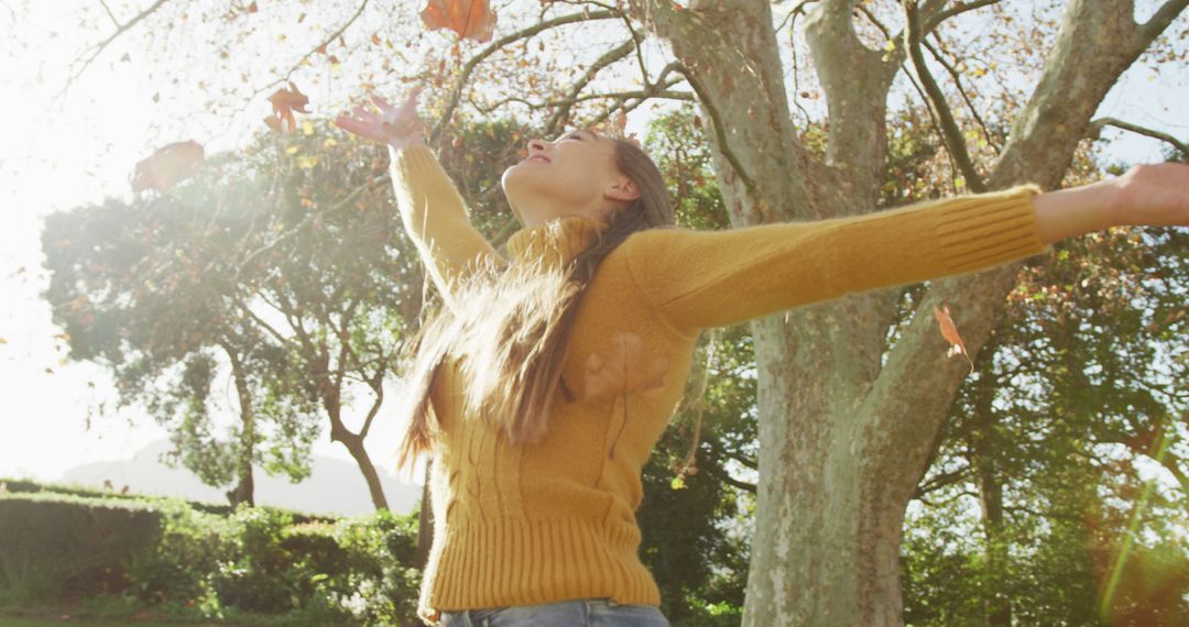 Woman Enjoying Time in Nature with Autumn Leaves - Free Images, Stock Photos and Pictures on Pikwizard.com