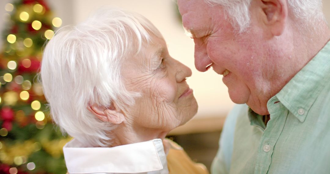 Senior Couple Sharing Tender Moment During Christmas Season - Free Images, Stock Photos and Pictures on Pikwizard.com