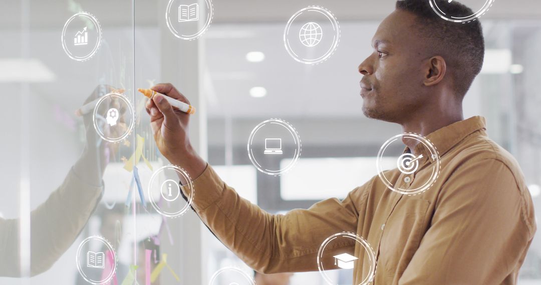 Businessman Analyzing Data on Whiteboard with Digital Icons