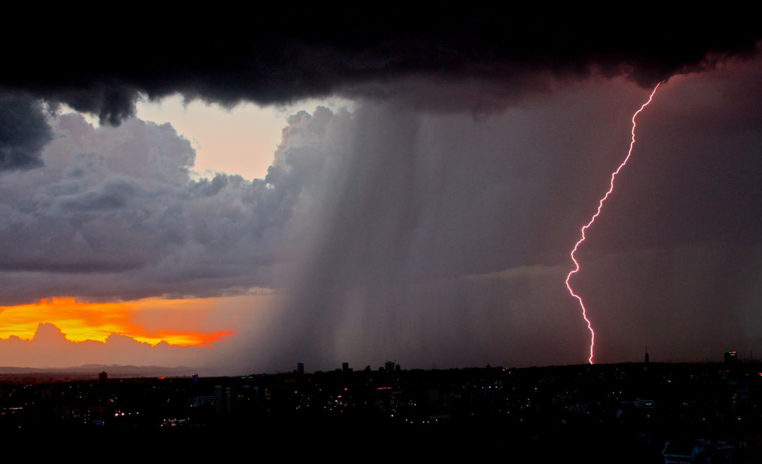 Dramatic Lightning Strike During a Stormy Sunset - Free Images, Stock Photos and Pictures on Pikwizard.com