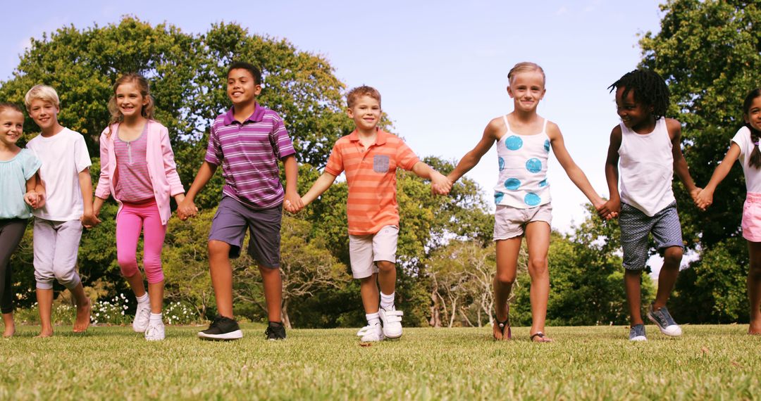 Group of Happy Multiracial Children Holding Hands in Park - Free Images, Stock Photos and Pictures on Pikwizard.com