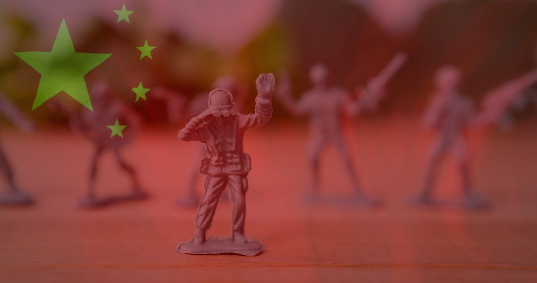 Toy soldiers silhouetted against chinese flag background