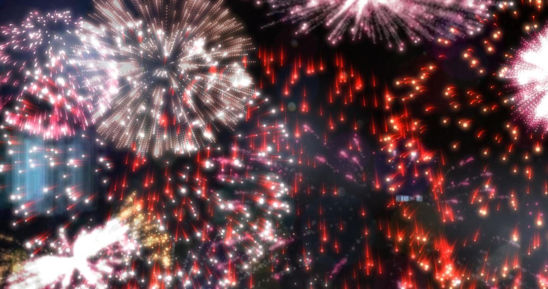 Vibrant Fireworks Explode in Night Sky over Cityscape