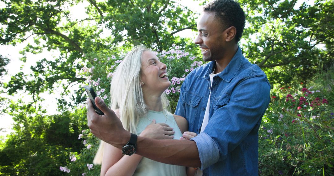 Happy Couple Celebrating Engagement in Vibrant Garden