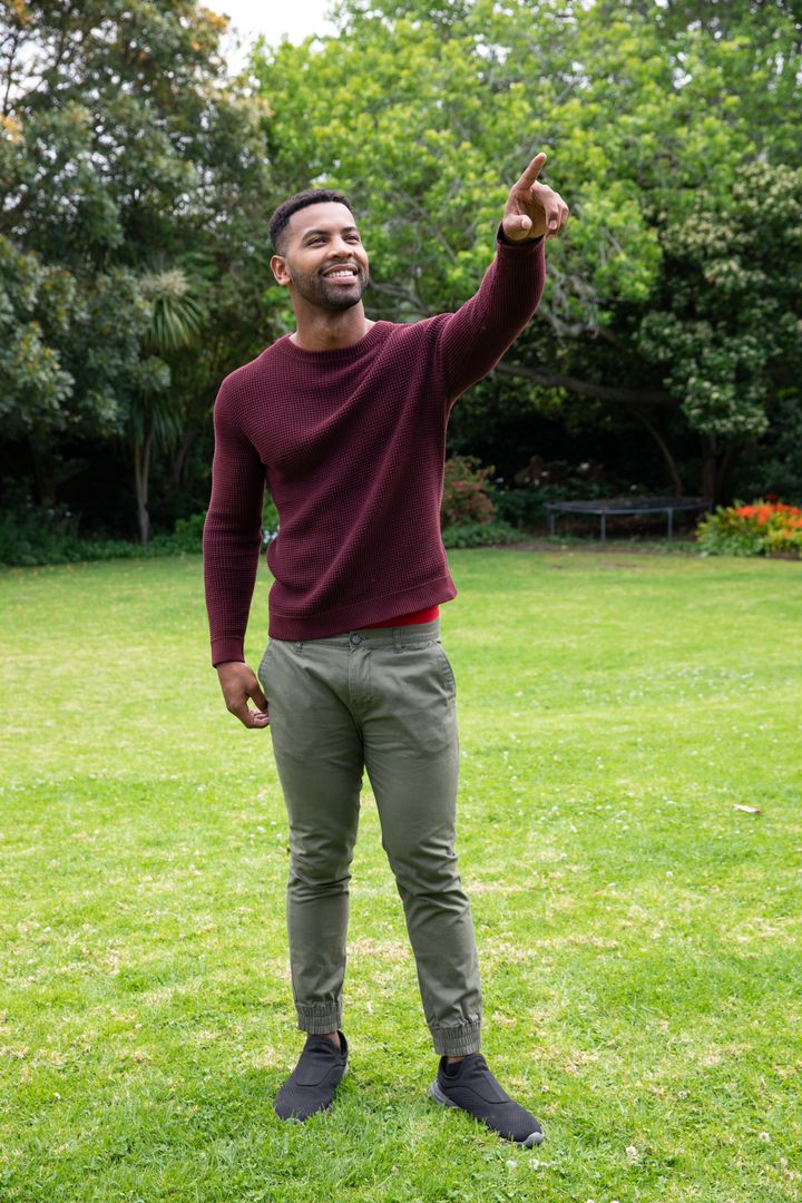 Man in Maroon Sweater Enjoying Park