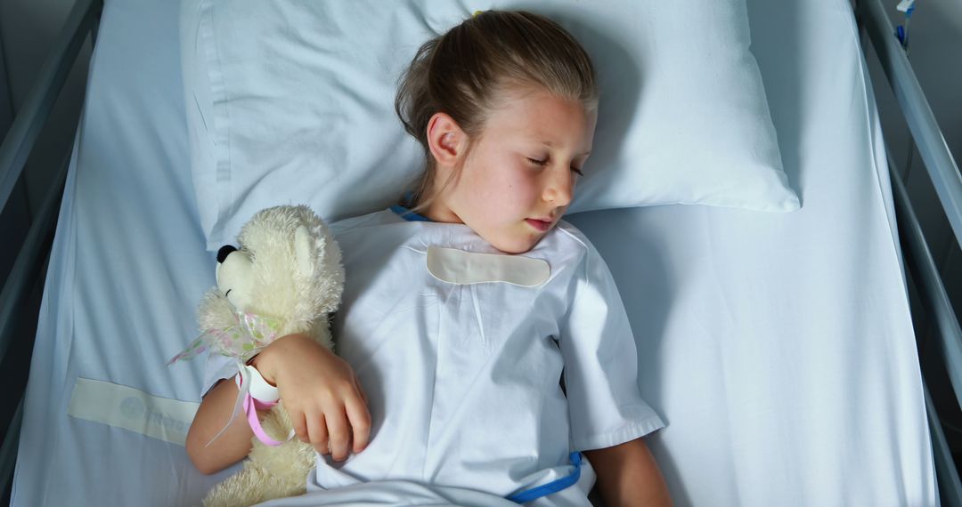 Young Girl Sleeping in Hospital Bed Holding Teddy Bear - Free Images, Stock Photos and Pictures on Pikwizard.com